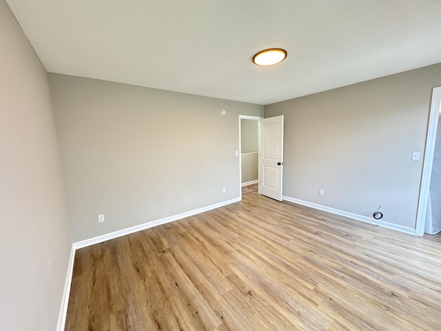 unfurnished room with light hardwood / wood-style floors