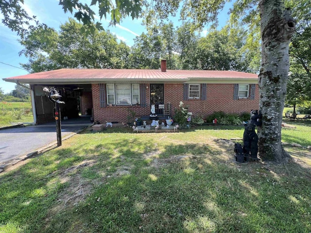 single story home featuring a front yard and a carport