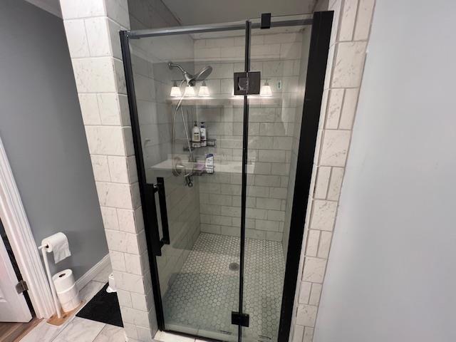 bathroom featuring an enclosed shower