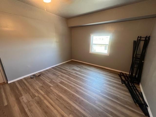 empty room with wood-type flooring