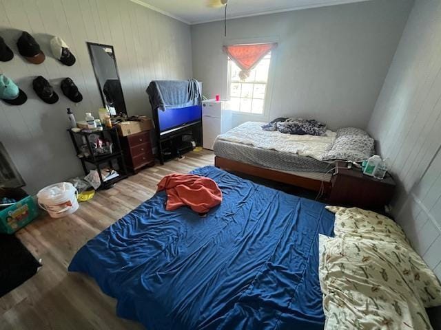 bedroom with wood-type flooring