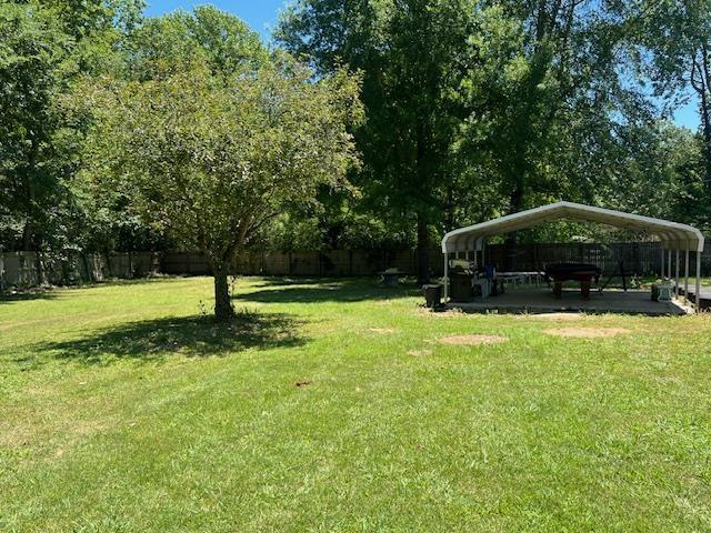 view of yard with a carport