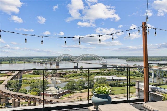 balcony featuring a water view