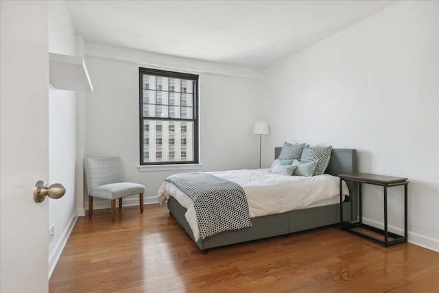 bedroom featuring wood-type flooring