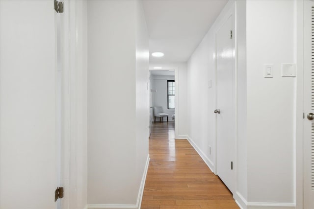 hall with light wood-type flooring