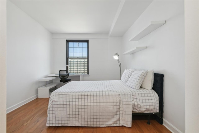 bedroom featuring hardwood / wood-style floors