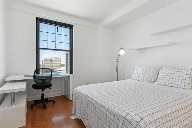 bedroom featuring dark wood-type flooring