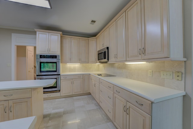 kitchen with crown molding, light tile patterned floors, backsplash, and stainless steel appliances