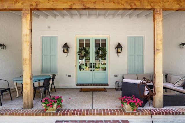 view of front of property featuring a front yard, covered porch, and a garage