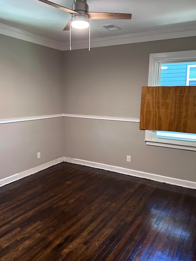 unfurnished room featuring dark hardwood / wood-style flooring, ceiling fan, and crown molding