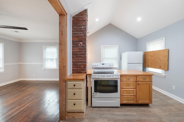 kitchen with lofted ceiling, white appliances, ceiling fan, butcher block counters, and dark hardwood / wood-style flooring