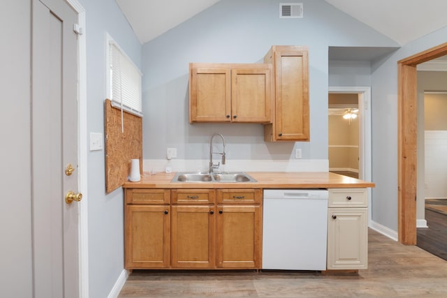 kitchen with light hardwood / wood-style floors, lofted ceiling, dishwasher, and sink