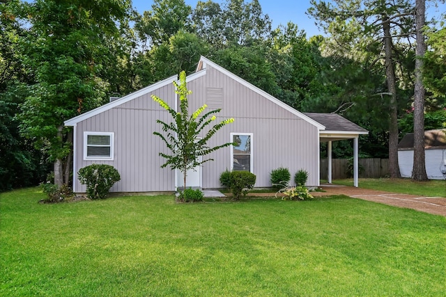 view of outbuilding featuring a lawn