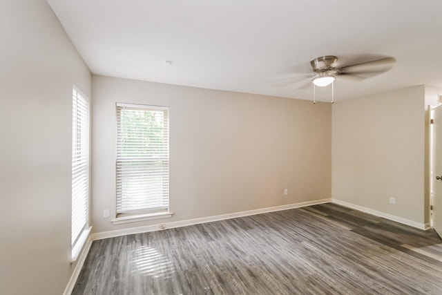 unfurnished room featuring dark hardwood / wood-style floors and ceiling fan