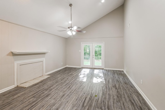 unfurnished living room featuring dark hardwood / wood-style floors, high vaulted ceiling, french doors, and ceiling fan