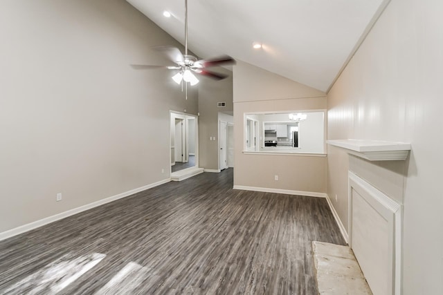 unfurnished living room with ceiling fan with notable chandelier, high vaulted ceiling, and dark hardwood / wood-style floors