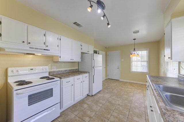 kitchen with white appliances, light tile patterned flooring, pendant lighting, white cabinets, and sink