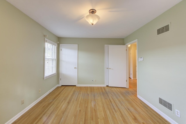 unfurnished bedroom with light hardwood / wood-style flooring