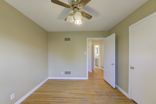 spare room featuring ceiling fan and light hardwood / wood-style floors