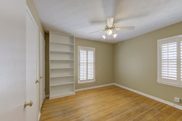 unfurnished bedroom featuring ceiling fan and light wood-type flooring