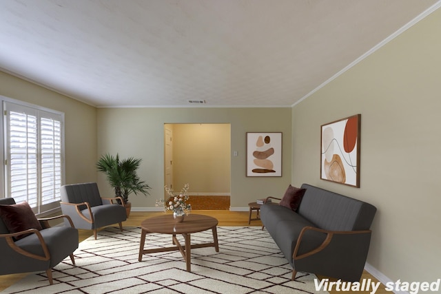 living room featuring crown molding and light hardwood / wood-style flooring