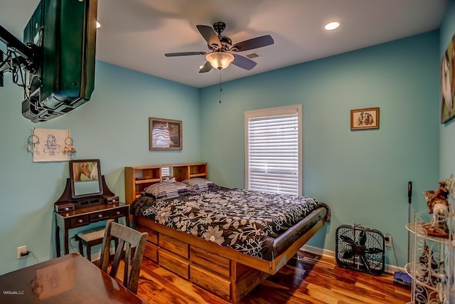 bedroom with ceiling fan and wood-type flooring