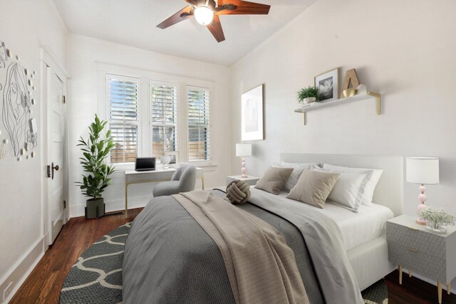 bedroom featuring ceiling fan and dark wood-type flooring