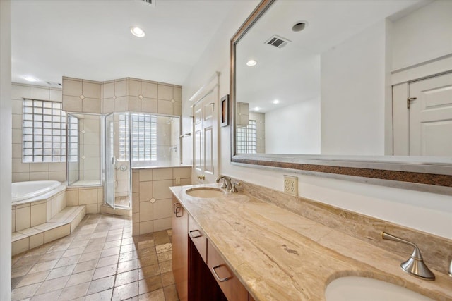 bathroom featuring vanity and plus walk in shower