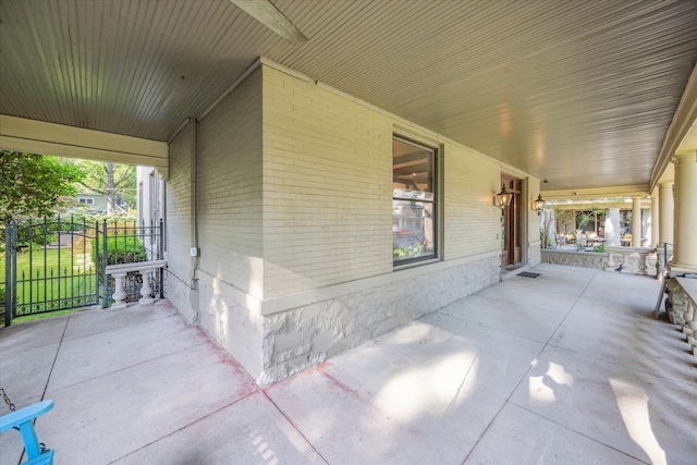 view of patio featuring a porch