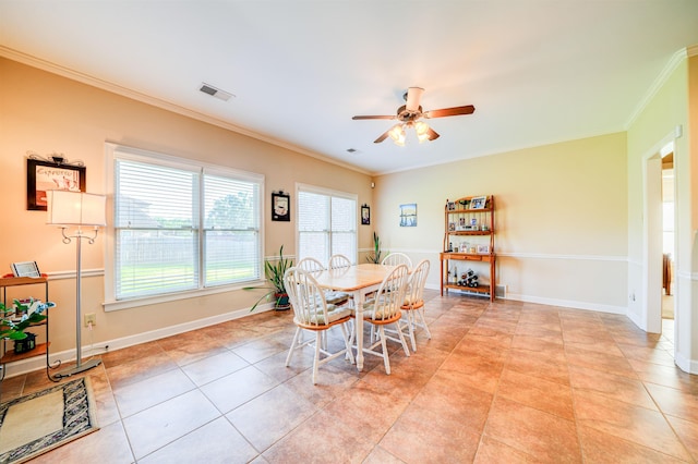 dining space featuring ornamental molding, ceiling fan, and light tile patterned flooring