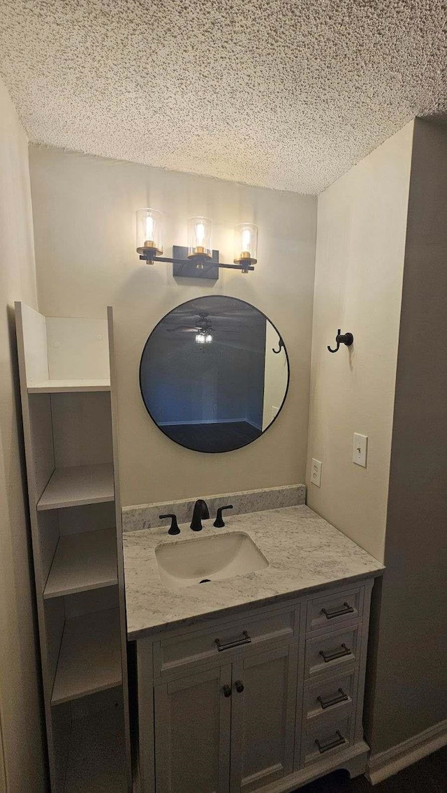 bathroom with vanity and a textured ceiling