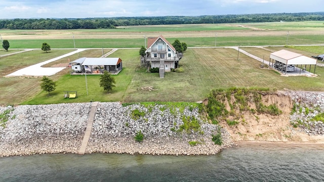 drone / aerial view with a water view and a rural view