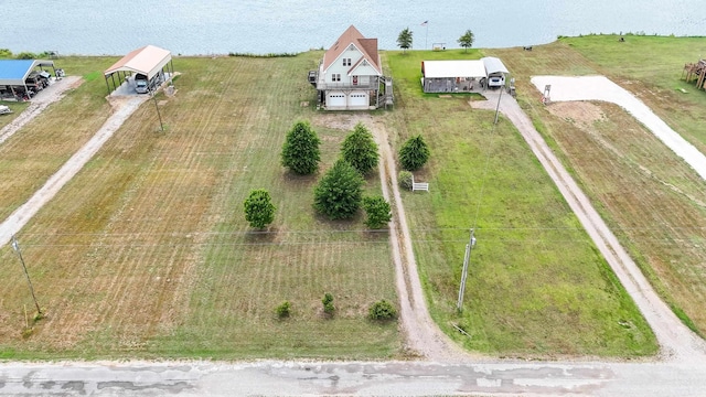 drone / aerial view featuring a rural view and a water view