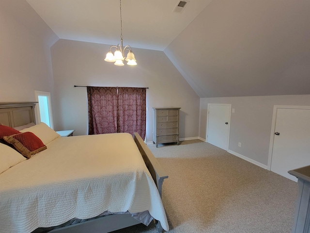 carpeted bedroom with lofted ceiling and an inviting chandelier