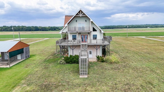 view of front of property featuring a balcony, a rural view, central AC unit, and a deck