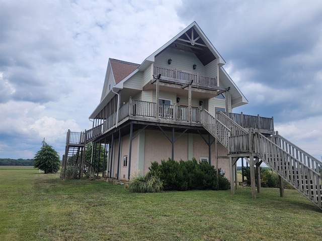 exterior space featuring a deck and a lawn