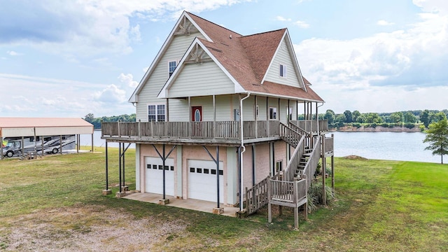 exterior space featuring a garage, a front yard, and a water view