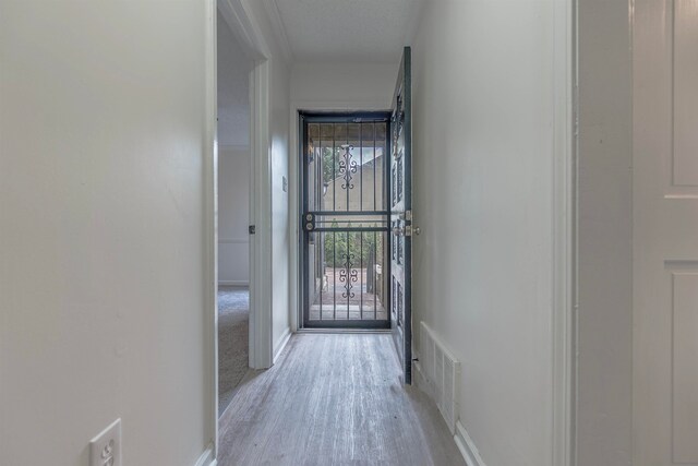 entryway with light hardwood / wood-style floors