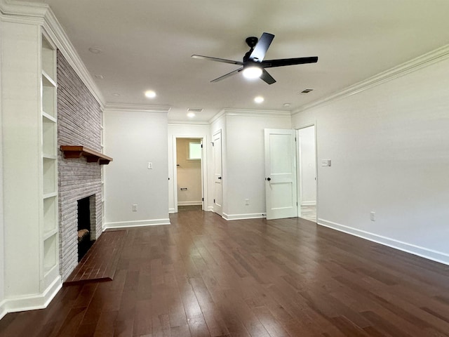 unfurnished living room featuring ceiling fan, built in features, a brick fireplace, dark hardwood / wood-style floors, and ornamental molding