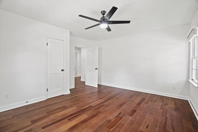 unfurnished bedroom featuring ceiling fan and dark hardwood / wood-style flooring