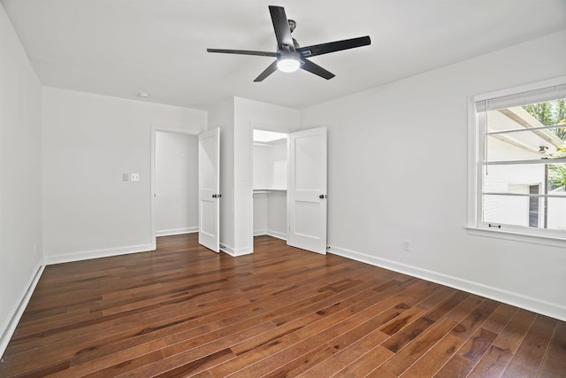 unfurnished bedroom with ceiling fan, dark hardwood / wood-style flooring, and a closet