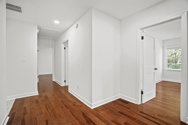 hallway with dark hardwood / wood-style flooring