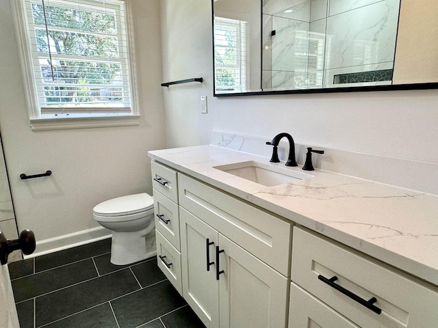 bathroom featuring toilet, vanity, an enclosed shower, and tile patterned flooring