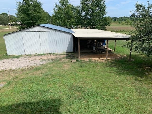 view of outdoor structure with a yard