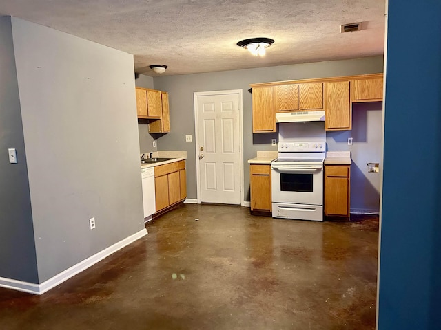 kitchen featuring a textured ceiling, white appliances, and sink