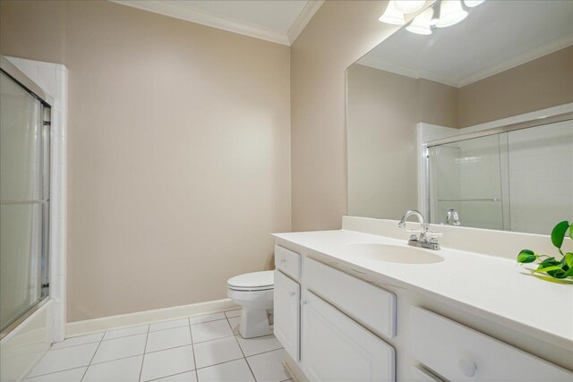 full bathroom featuring enclosed tub / shower combo, tile patterned flooring, toilet, vanity, and ornamental molding