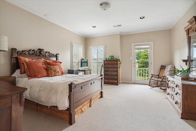 carpeted bedroom with crown molding and access to outside