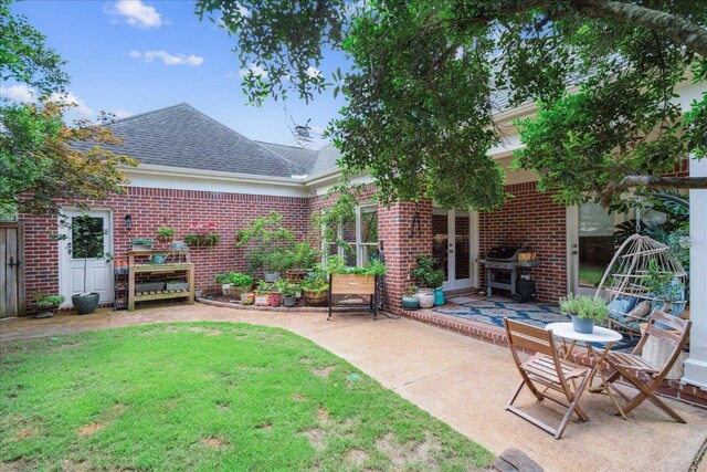 exterior space featuring a yard and a patio area