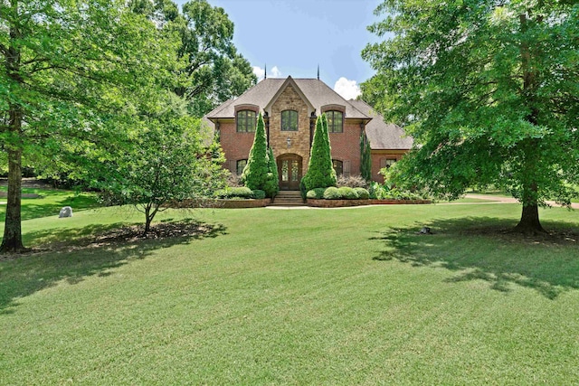 125 Millbury Ln, Eads, TN 38028 - french provincial home with a front yard, french doors, and brick siding