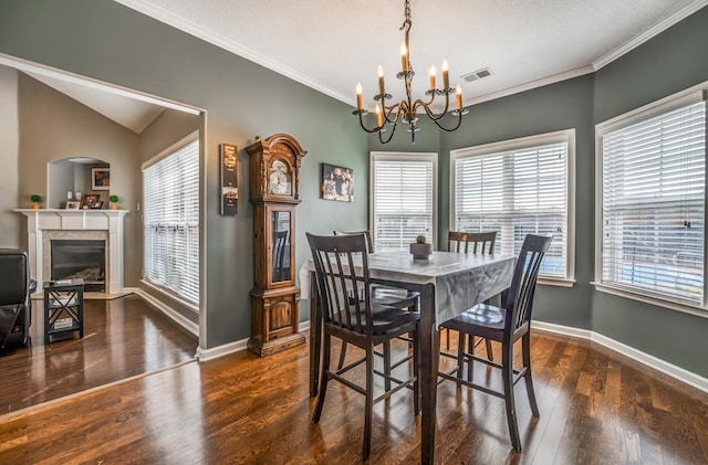 dining room featuring a notable chandelier, crown molding, and dark wood-type flooring